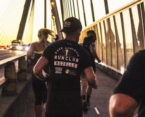 Rozelle Run Club runners crossing the ANZAC Bridge, Sydney