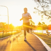 Marathon runner training with sunset backdrop